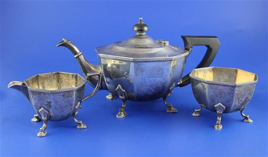 A 1930s three piece silver tea set by Mappin & Webb, gross 29 oz.